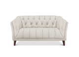 A cream-colored tufted loveseat sofa with dark brown wooden legs, shown from a front-facing perspective on a white background.