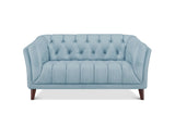 A light blue tufted loveseat sofa with dark brown wooden legs, shown from a front-facing perspective on a solid white background.