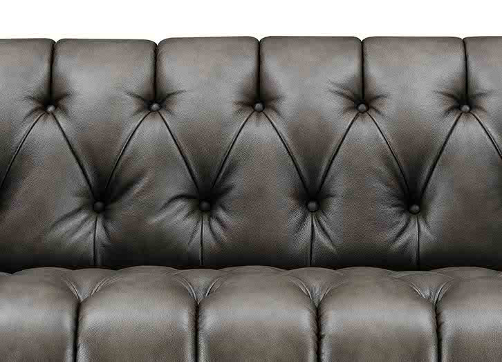 Brown leather sofa with tufted backrest on a white background