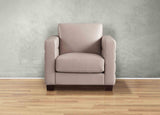 Beige armchair against a gray wall on a wooden floor