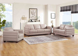 Gray sofa set in a living room with large windows and decor.
