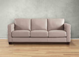 Beige sofa on a wooden floor with a gray wall background
