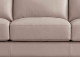 Close-up of a beige sofa with visible stitching