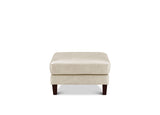 A square upholstered ottoman in light beige fabric with dark brown wooden legs, shown against a plain white background.
