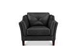 A brown leather armchair with a diamond-quilted backrest and rolled arms, shown from the front on a white background.