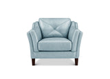 A light blue upholstered armchair with a diamond-quilted backrest, curved arms, and dark wooden legs, shown against a plain white background.