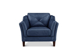 A single upholstered armchair in dark blue leather with a diamond-quilted backrest and dark wooden legs, shown against a plain white background.