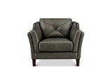 A brown leather armchair with a diamond-quilted backrest and rolled arms, shown from the front on a white background.