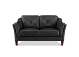 A black faux leather loveseat sofa with diamond tufting on the backrests and dark brown wooden legs, shown against a plain white background.