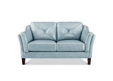 A light blue upholstered loveseat with diamond-quilted back cushions, rolled arms, and dark brown wooden legs, shown against a plain white background.
