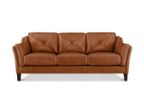 A three-seat sofa upholstered in warm cognac brown leather, featuring diamond-quilted back cushions and dark wooden legs, shown against a plain white background.