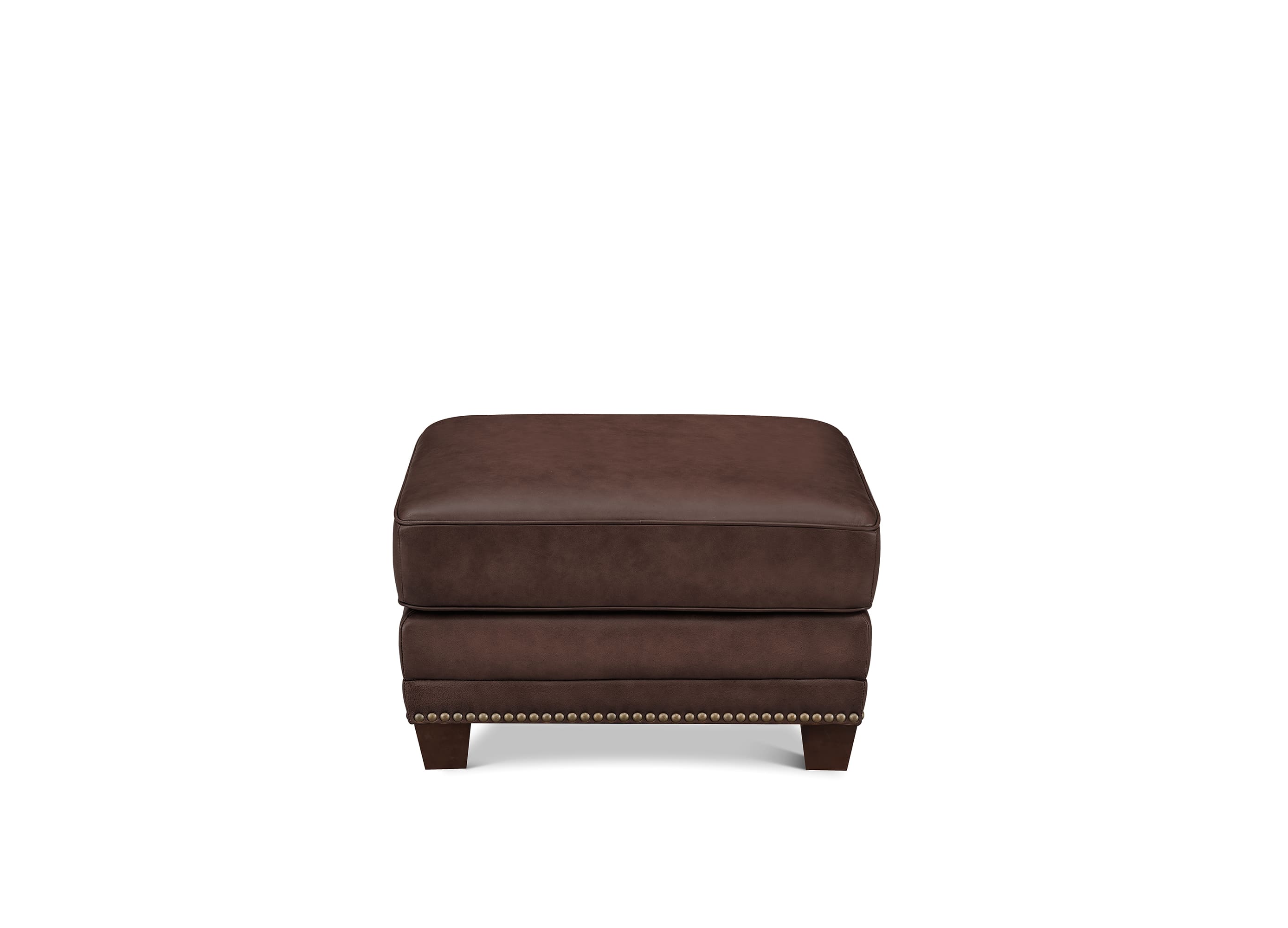 A dark brown upholstered ottoman with a low rectangular cushion, short legs, and nailhead trim along the front edge, shown against a plain white background.