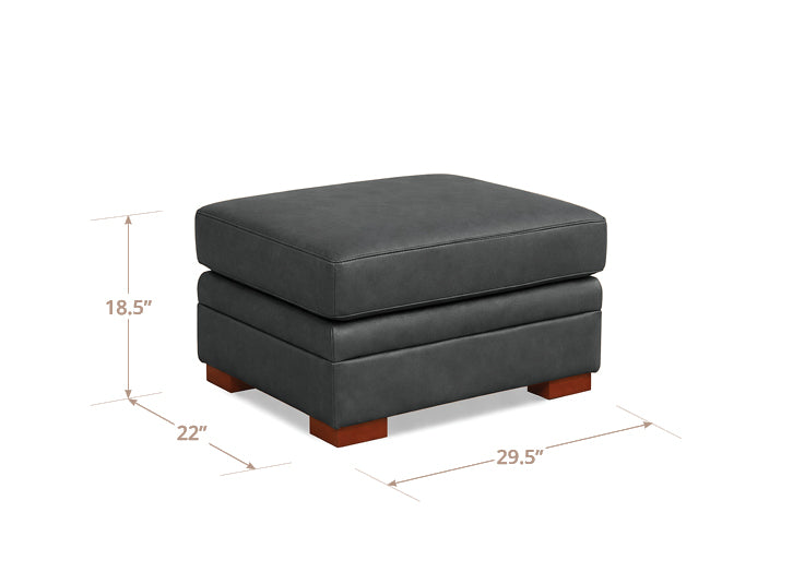 Gray ottoman with dimensions labeled on a white background