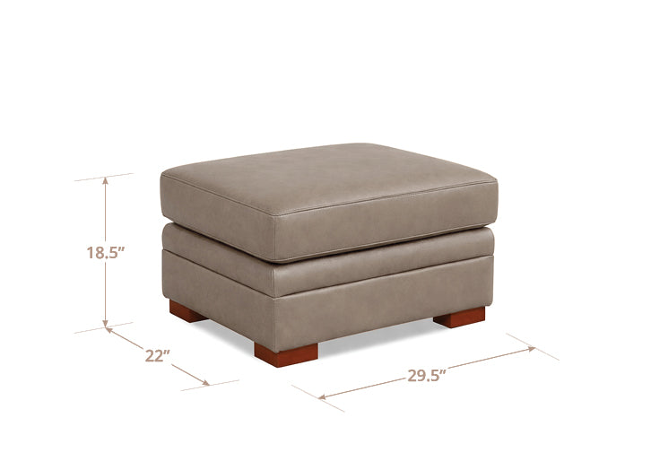 Beige ottoman with dimensions labeled on a white background