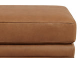 Close-up of a brown leather ottoman on a white background