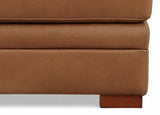 Close-up of a brown upholstered piece of furniture on a white background