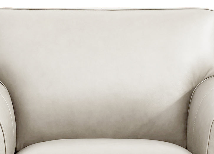 Close-up of a beige armchair with a soft texture