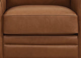 Close-up of a brown leather armchair seat