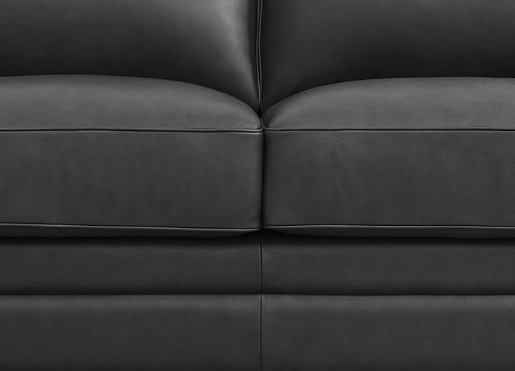 Close-up of a dark gray leather sofa