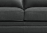 Close-up of a dark gray leather sofa