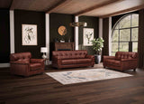 Brown leather sofa set in a living room with dark walls and large window.