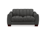 A dark gray upholstered loveseat with vertical channel tufting on the backrest and seat cushions, shown against a plain white background.