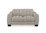 A light beige upholstered loveseat with vertical channel tufting on the backrest and seat, dark reddish-brown wooden legs, and a clean white background.