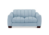 A light blue upholstered loveseat with vertical channel tufting on the backrest and seat cushions, shown against a plain white background.