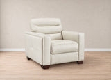 A modern off-white leather armchair with dark brown wooden legs, positioned on a light wood floor against a neutral beige wall.