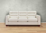 White sofa on a wooden floor with a gray wall background