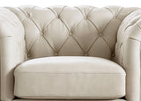 Beige tufted sofa with diamond pattern on a white background