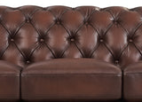 Brown leather sofa with tufted backrest on a white background