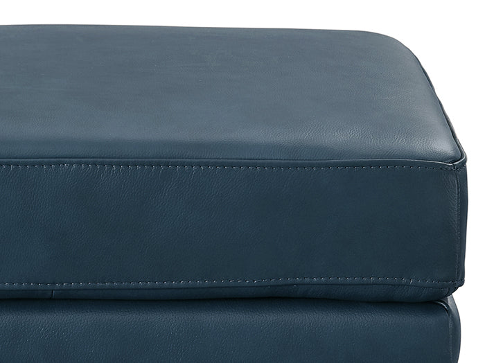 Navy blue pants with textured fabric and button detail on a white background