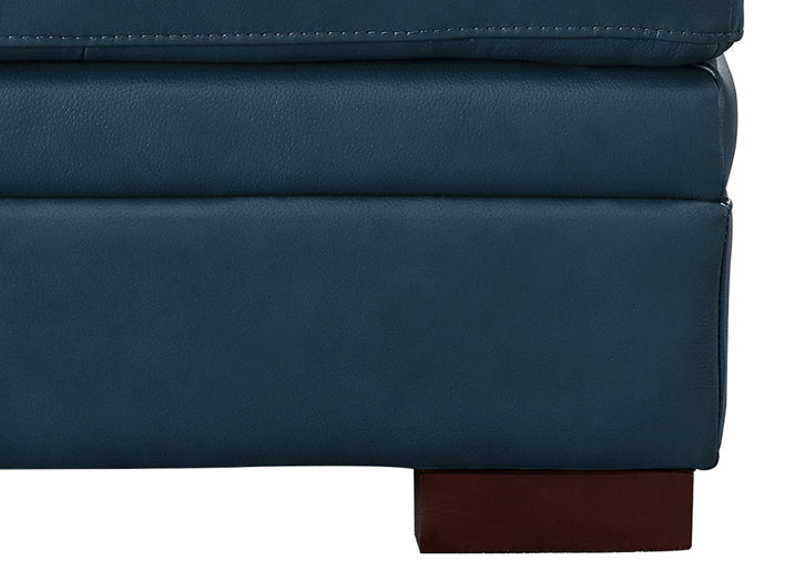 Close-up of a blue leather ottoman with a wooden leg on a white background