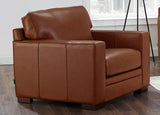 Brown leather armchair in a room with a window in the background