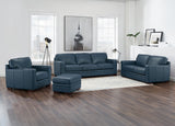 Blue leather sofa set in a modern living room with wooden flooring and large windows.
