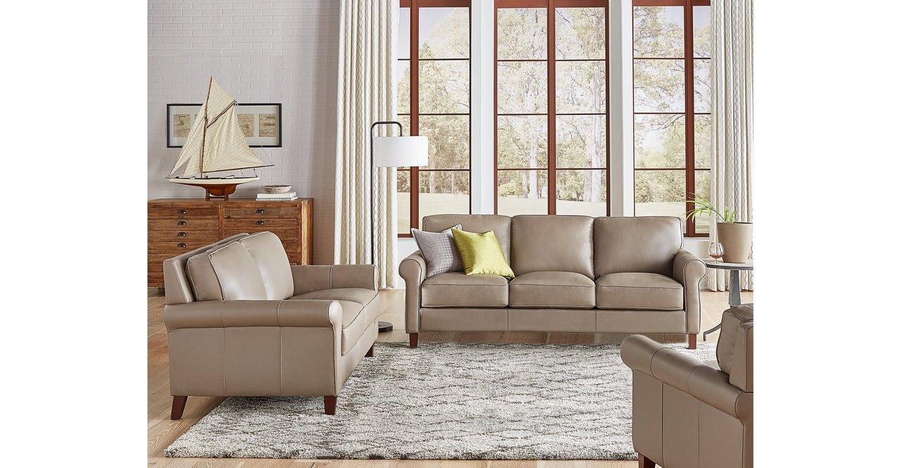 Taupe leather store sofa and loveseat